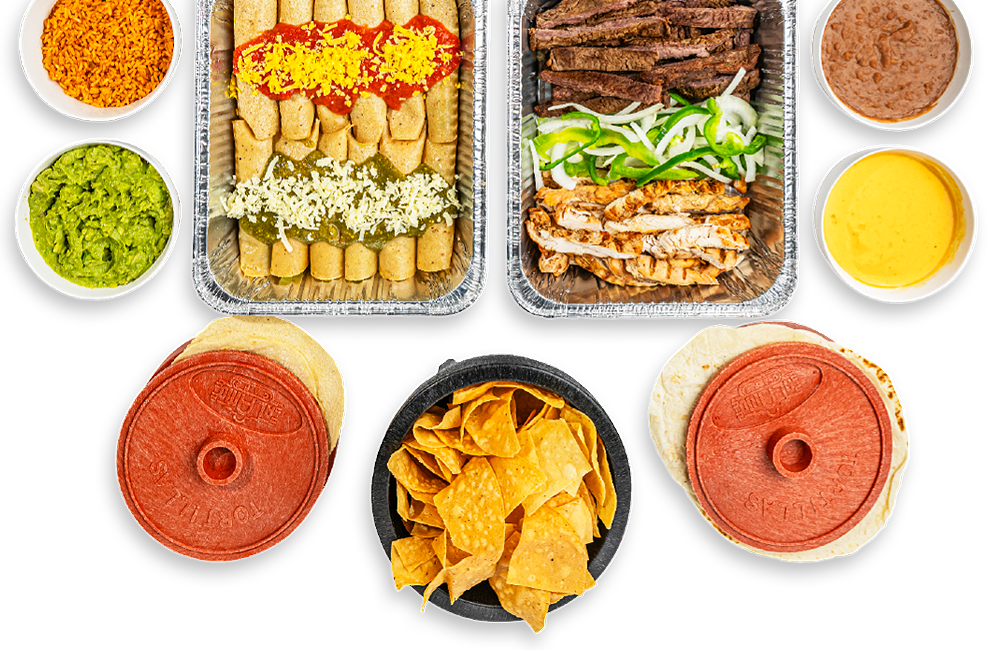 Catering trays of fajitas, enchiladas and quesadillas with salsas, queso and chips