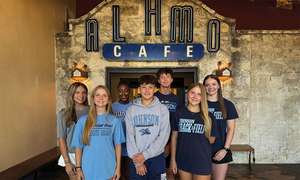 A team photo outside Alamo Cafe