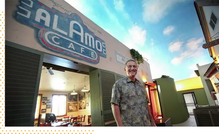 A team member outside the Alamo Cafe entrance