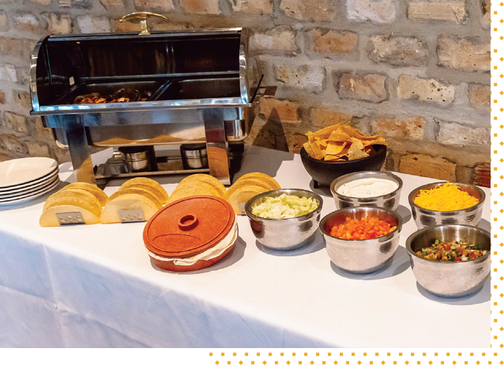 A buffet line of Tex-Mex dishes