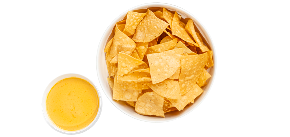 A bowl of chips and a cup of queso